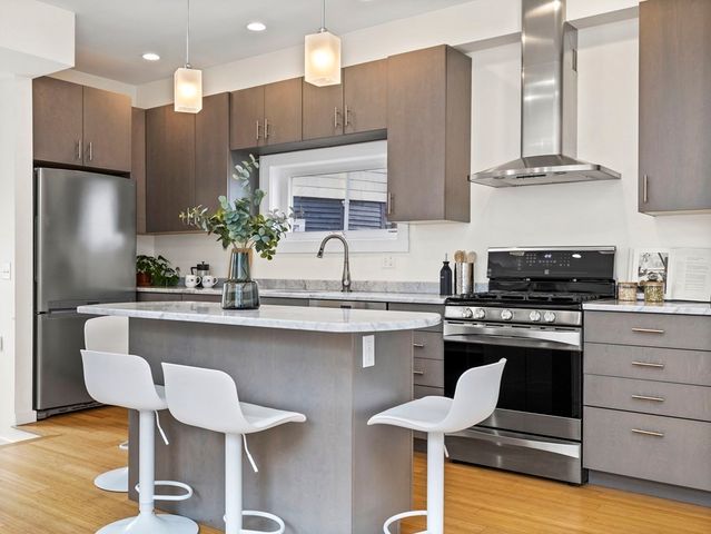 a spacious bedroom with a bed and glass windows