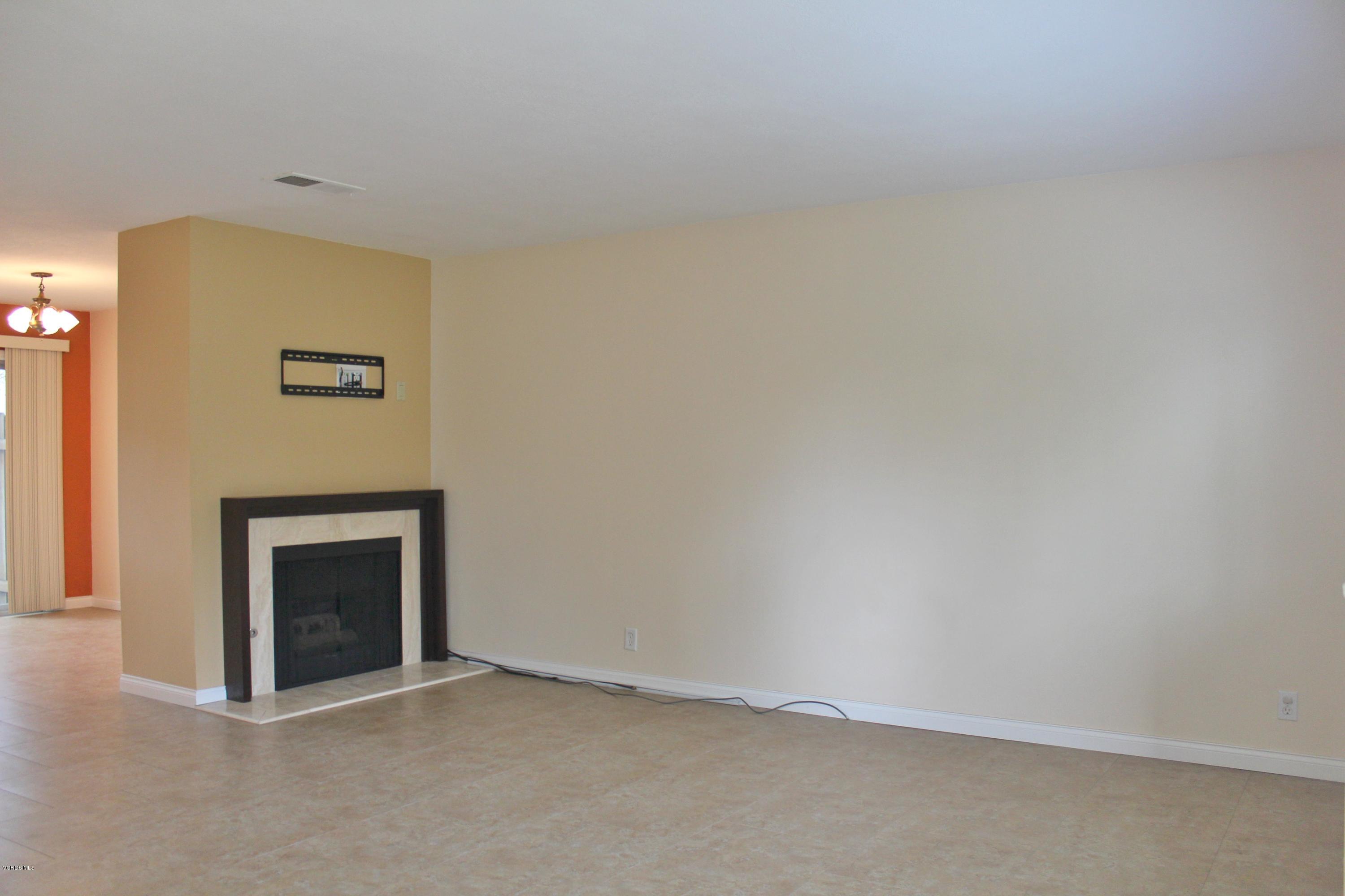 3127 Kelp Lane Oxnard, CA 93035 - Photo 2 of 16 a view of an empty room with a fireplace