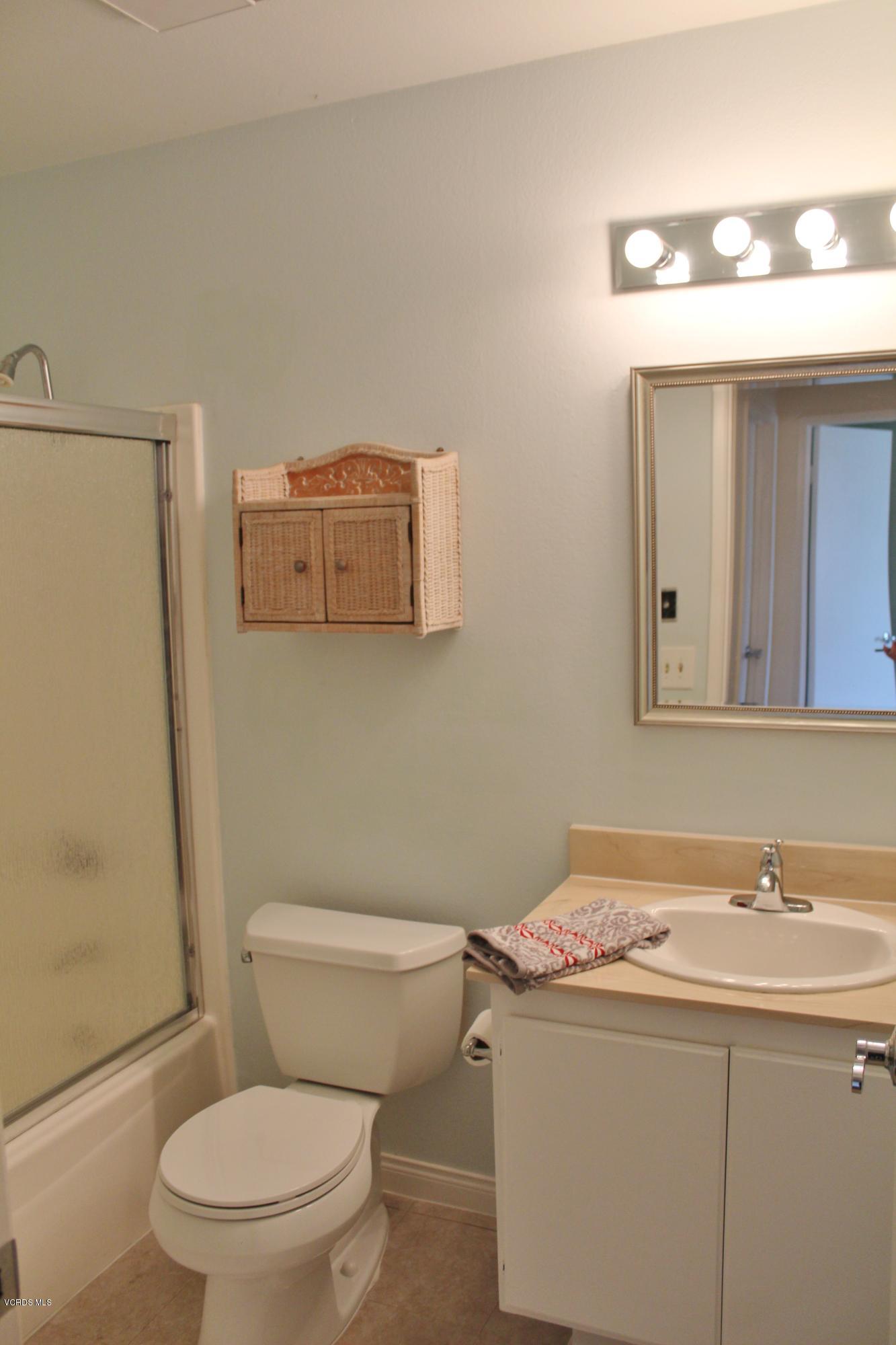 3127 Kelp Lane Oxnard, CA 93035 - Photo 9 of 16 a bathroom with a sink a toilet and a mirror