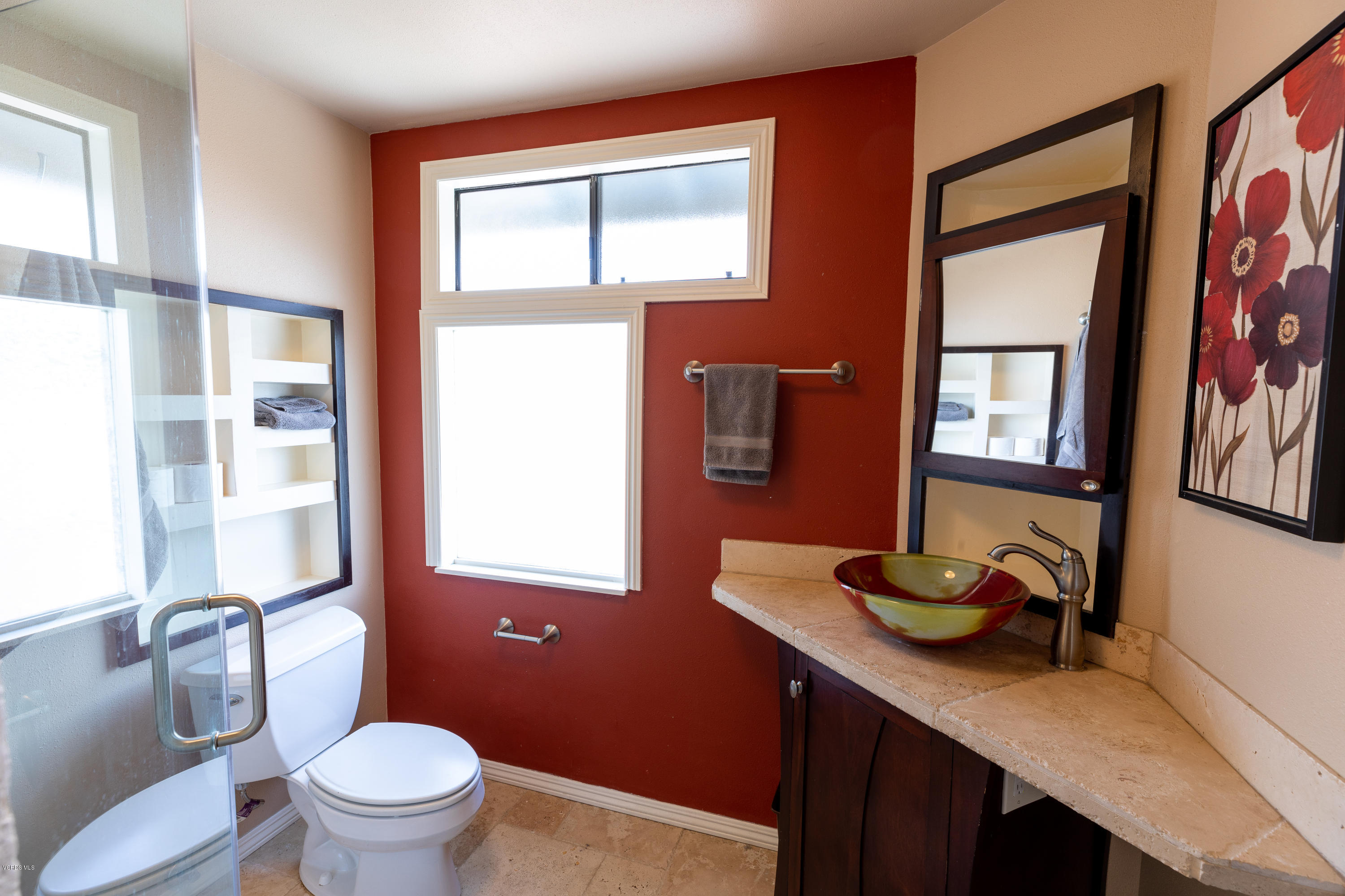 13635 Gunsmoke Road Moorpark, CA 93021 - Photo 23 of 34 a bathroom with a granite countertop sink mirror vanity and toilet