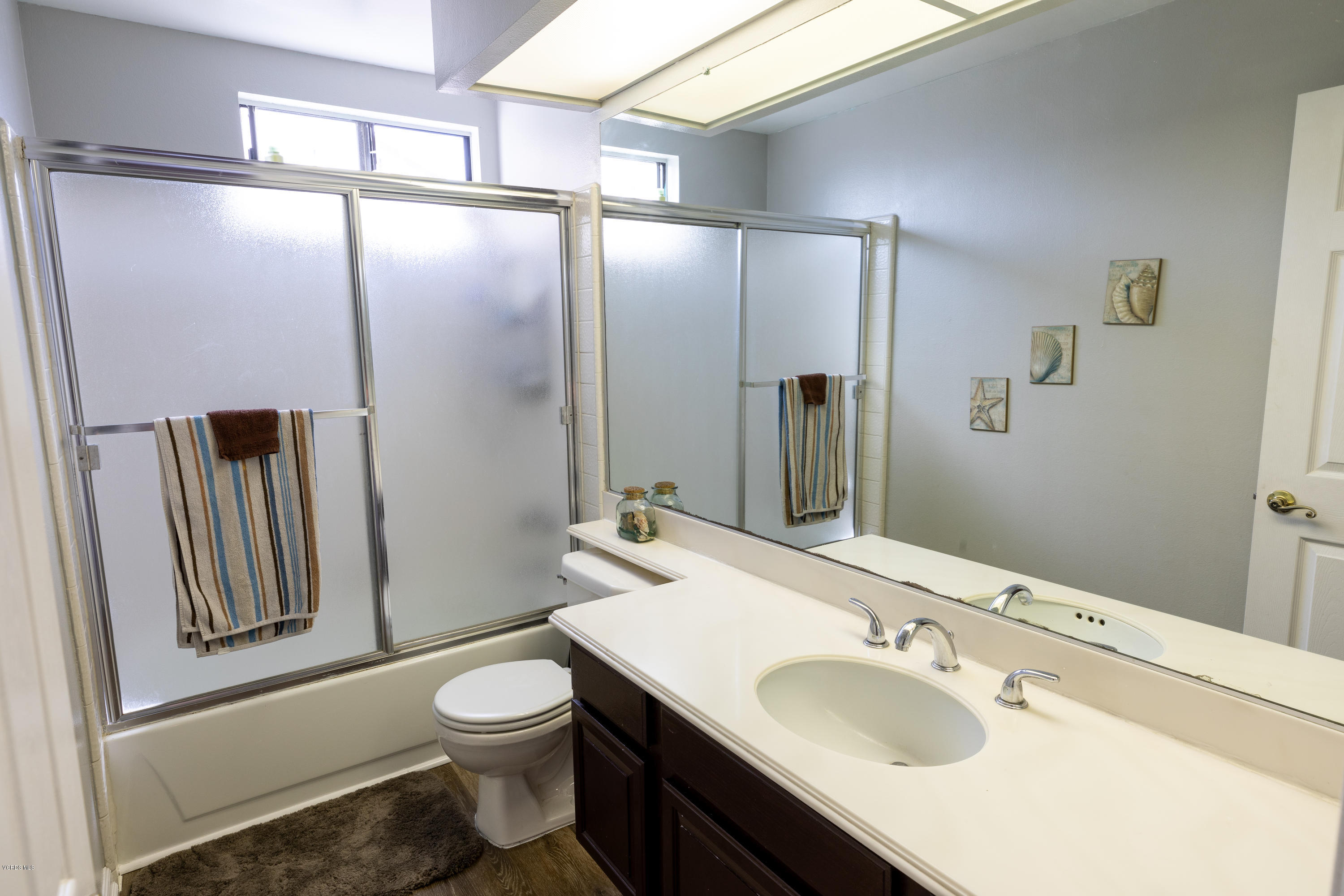 13635 Gunsmoke Road Moorpark, CA 93021 - Photo 25 of 34 a bathroom with a sink toilet and shower