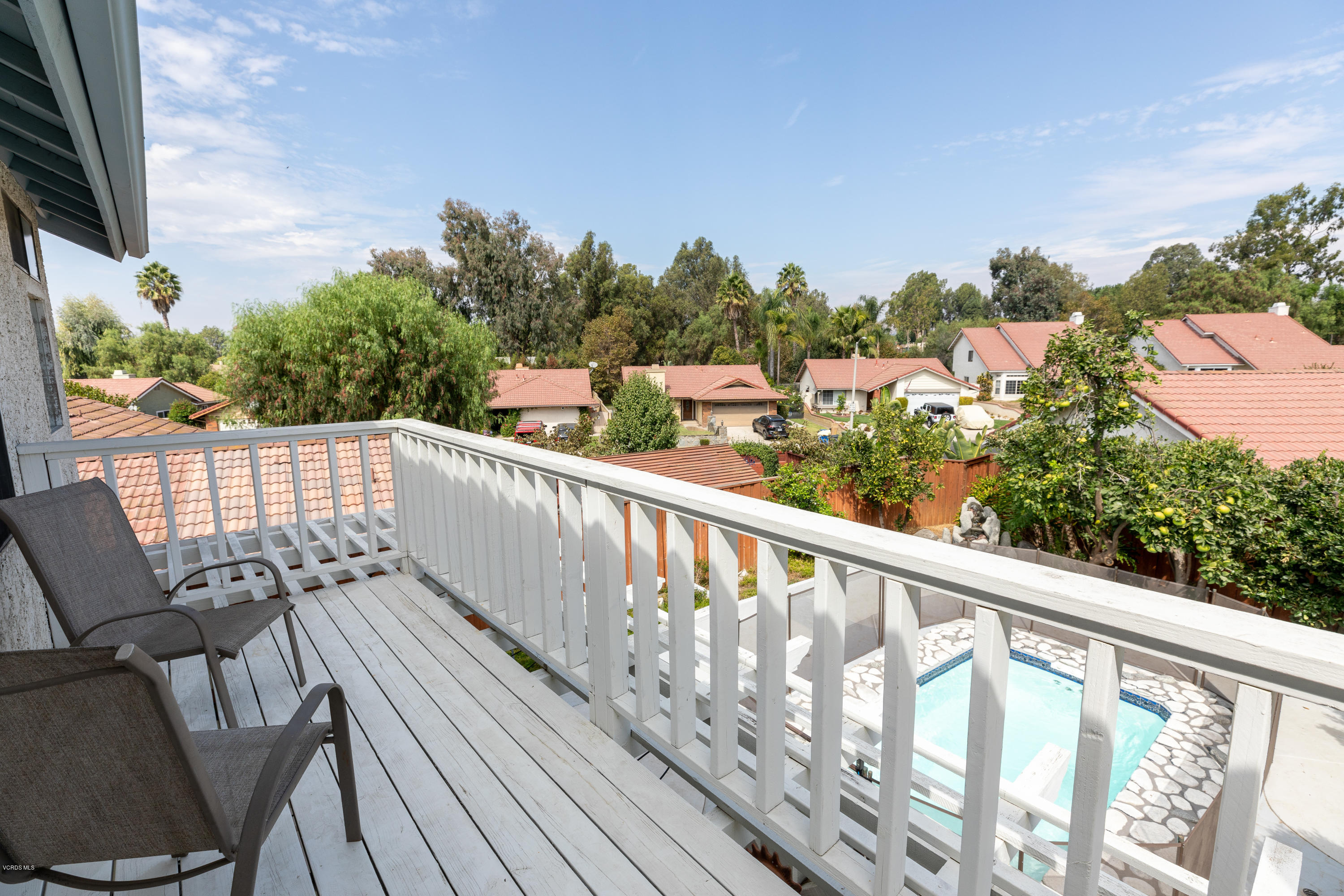 13635 Gunsmoke Road Moorpark, CA 93021 - Photo 30 of 34 a view of a balcony with wooden floor and outdoor seating
