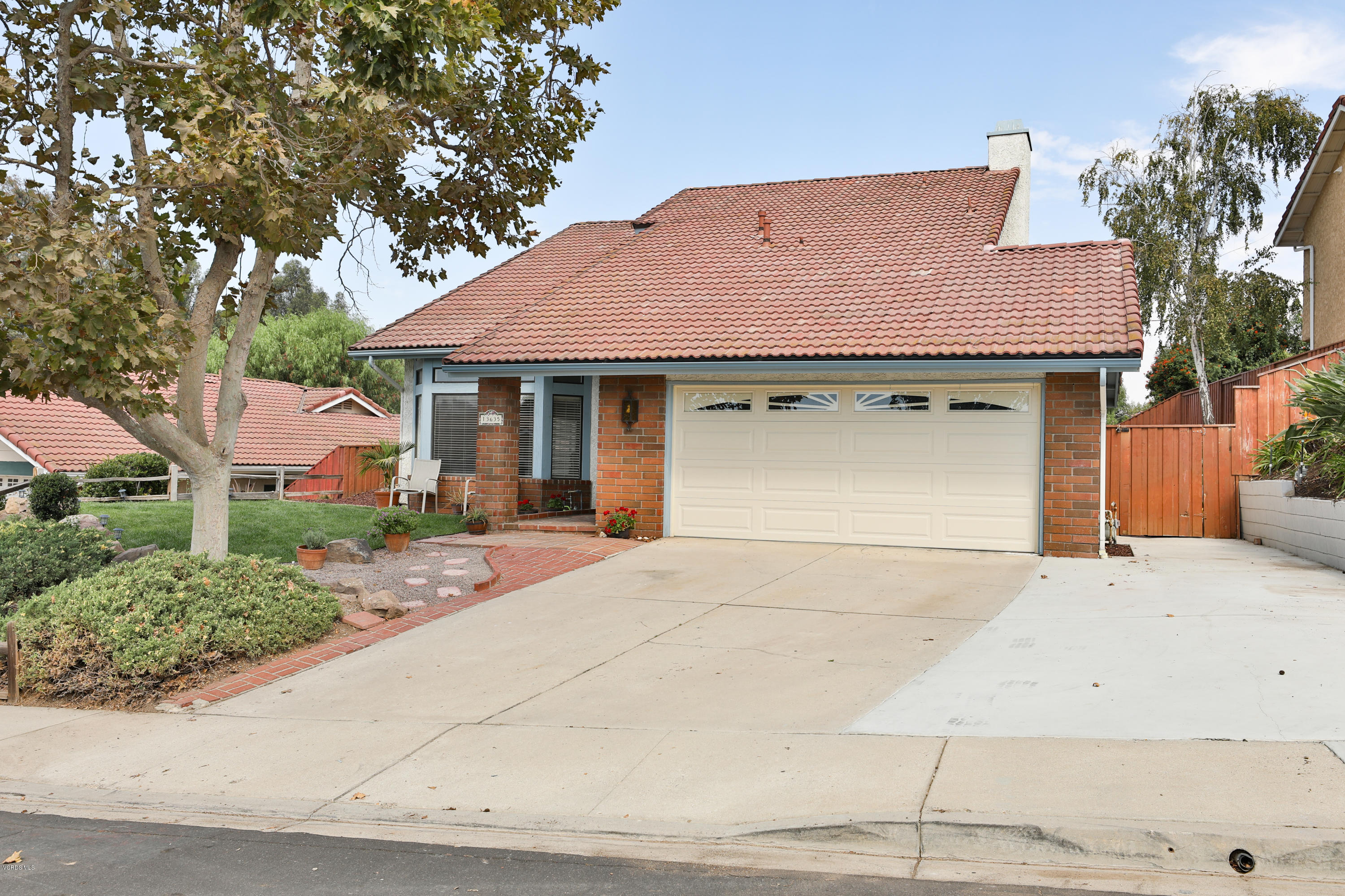 13635 Gunsmoke Road Moorpark, CA 93021 - Photo 6 of 34 a house with yard in front of it