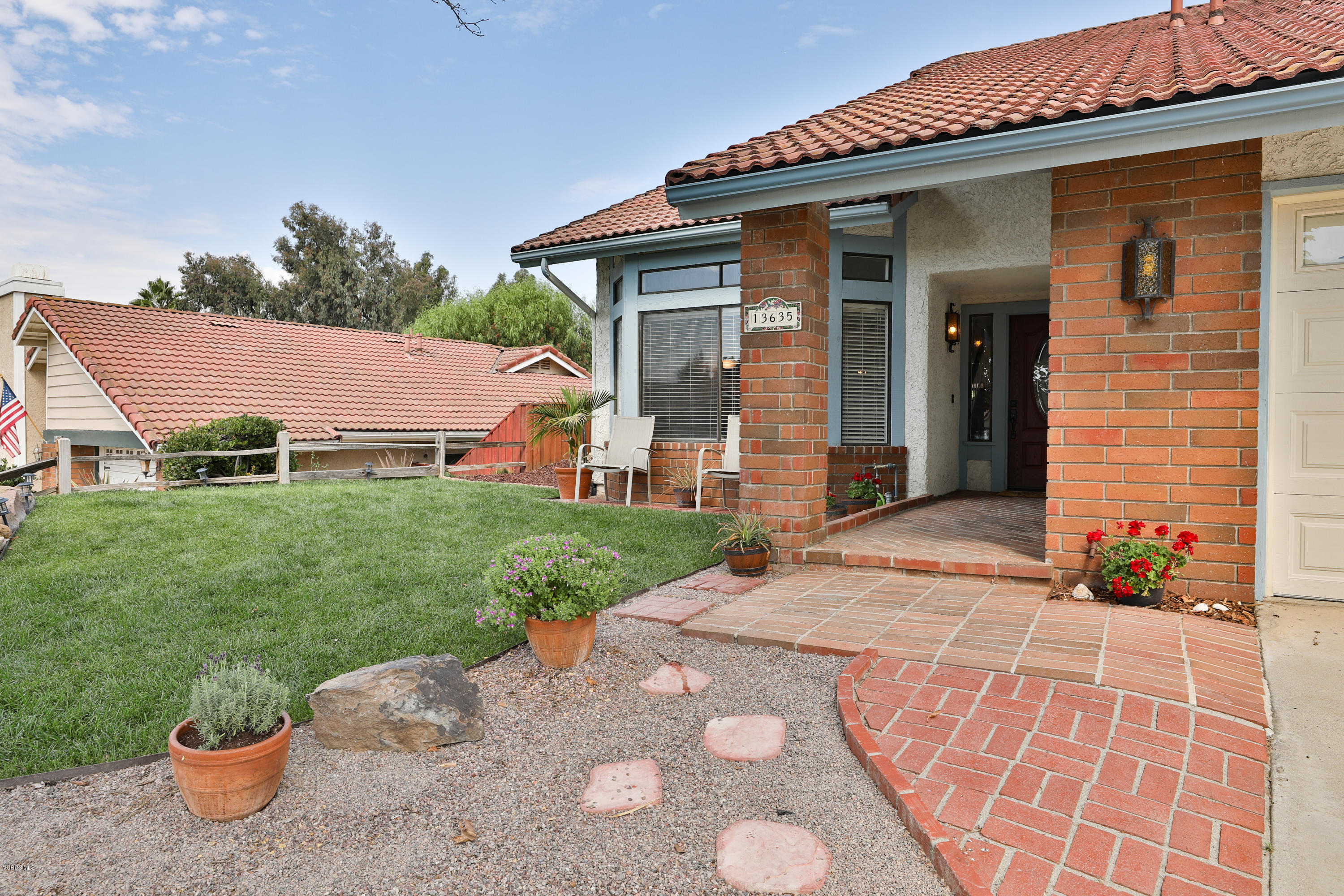 13635 Gunsmoke Road Moorpark, CA 93021 - Photo 7 of 34 a front view of a house with garden