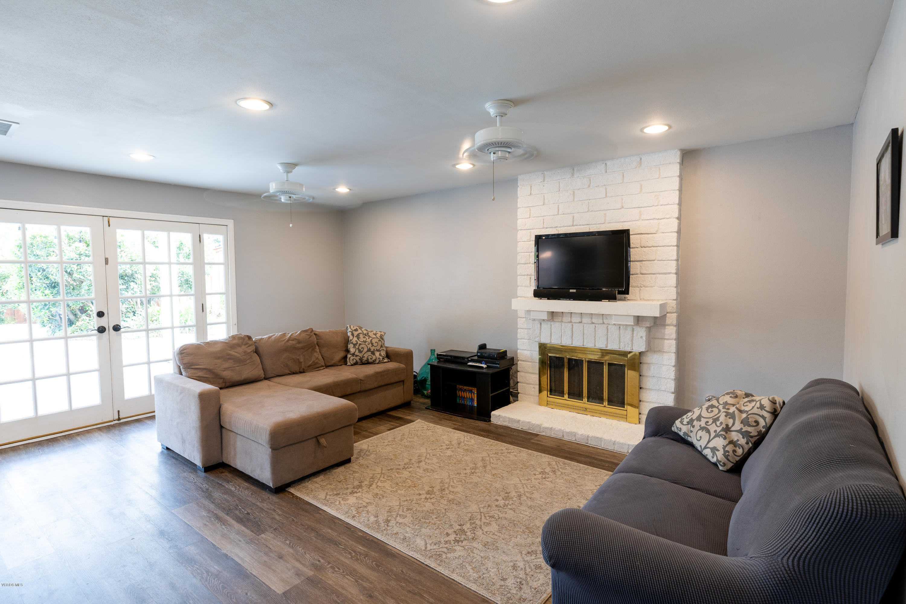 13635 Gunsmoke Road Moorpark, CA 93021 - Photo 9 of 34 a living room with furniture and a flat screen tv