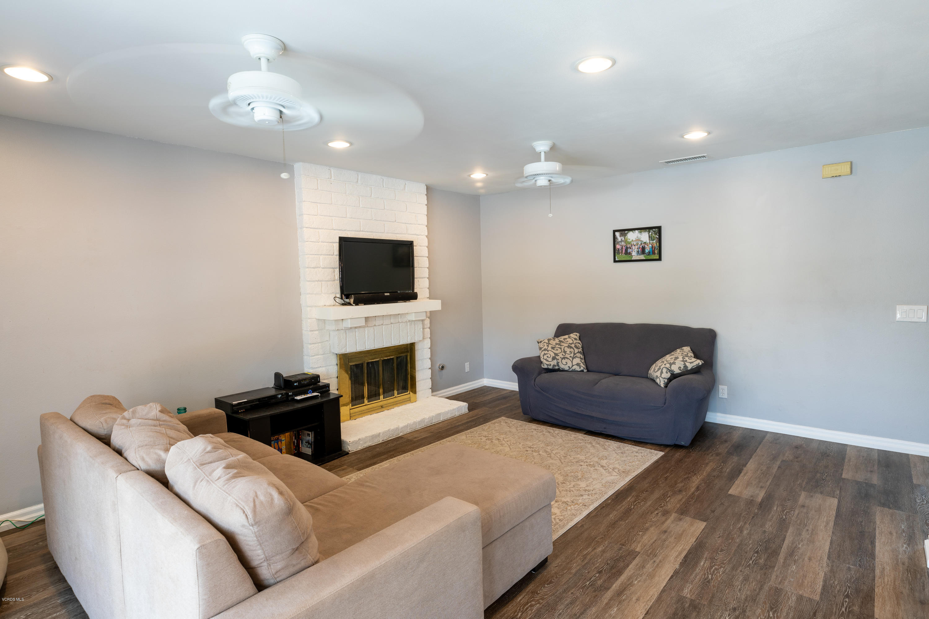 13635 Gunsmoke Road Moorpark, CA 93021 - Photo 10 of 34 a living room with furniture and a flat screen tv