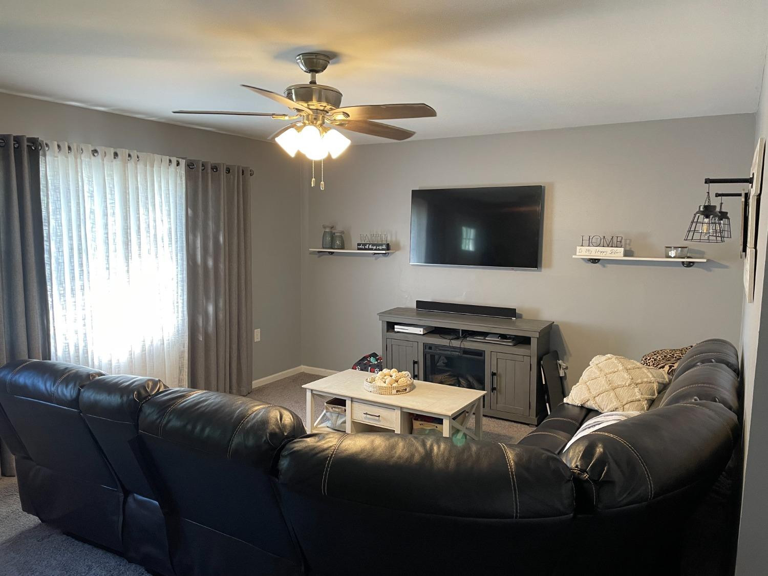 746-1 Governor Road Valparaiso, IN 46385 - Photo 3 of 13 a living room with furniture and a flat screen tv