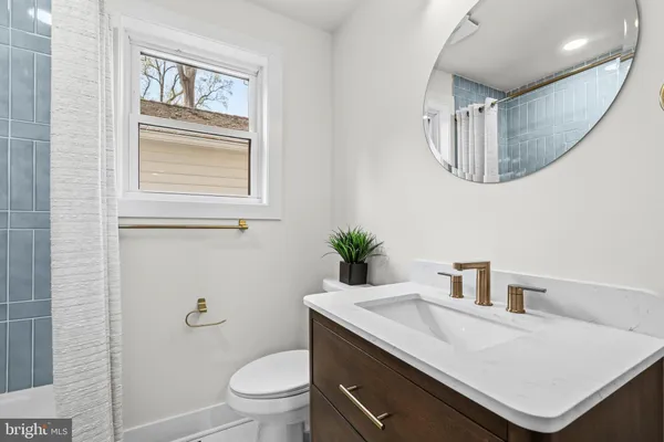 a spacious bedroom with a bed and a table