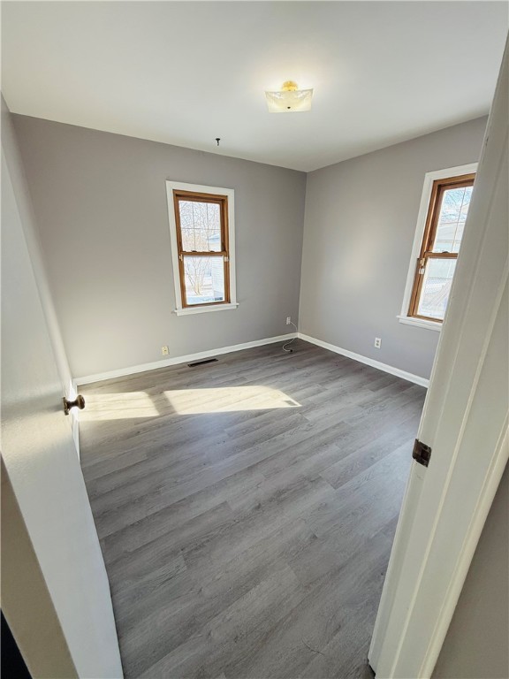56 Maple Court Decatur, IL 62526 - Photo 15 of 31 an empty room with wooden floor and windows