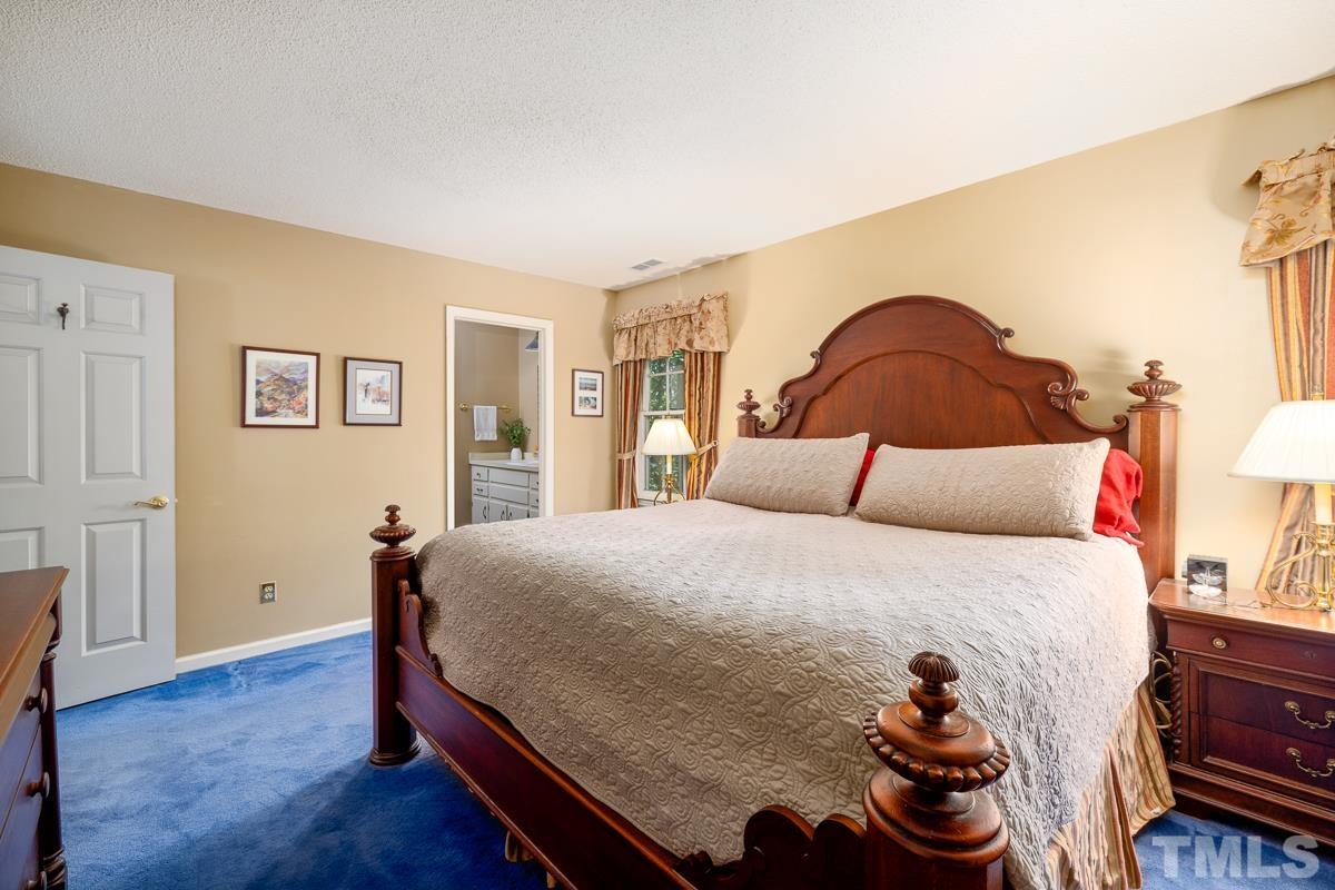 7320 Old Hundred Road Raleigh, NC 27613 - Photo 19 of 39 a bedroom with a bed and closet
