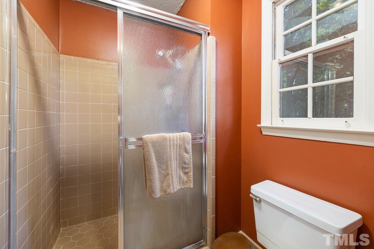 7320 Old Hundred Road Raleigh, NC 27613 - Photo 21 of 39 a white toilet sitting next to a bathroom
