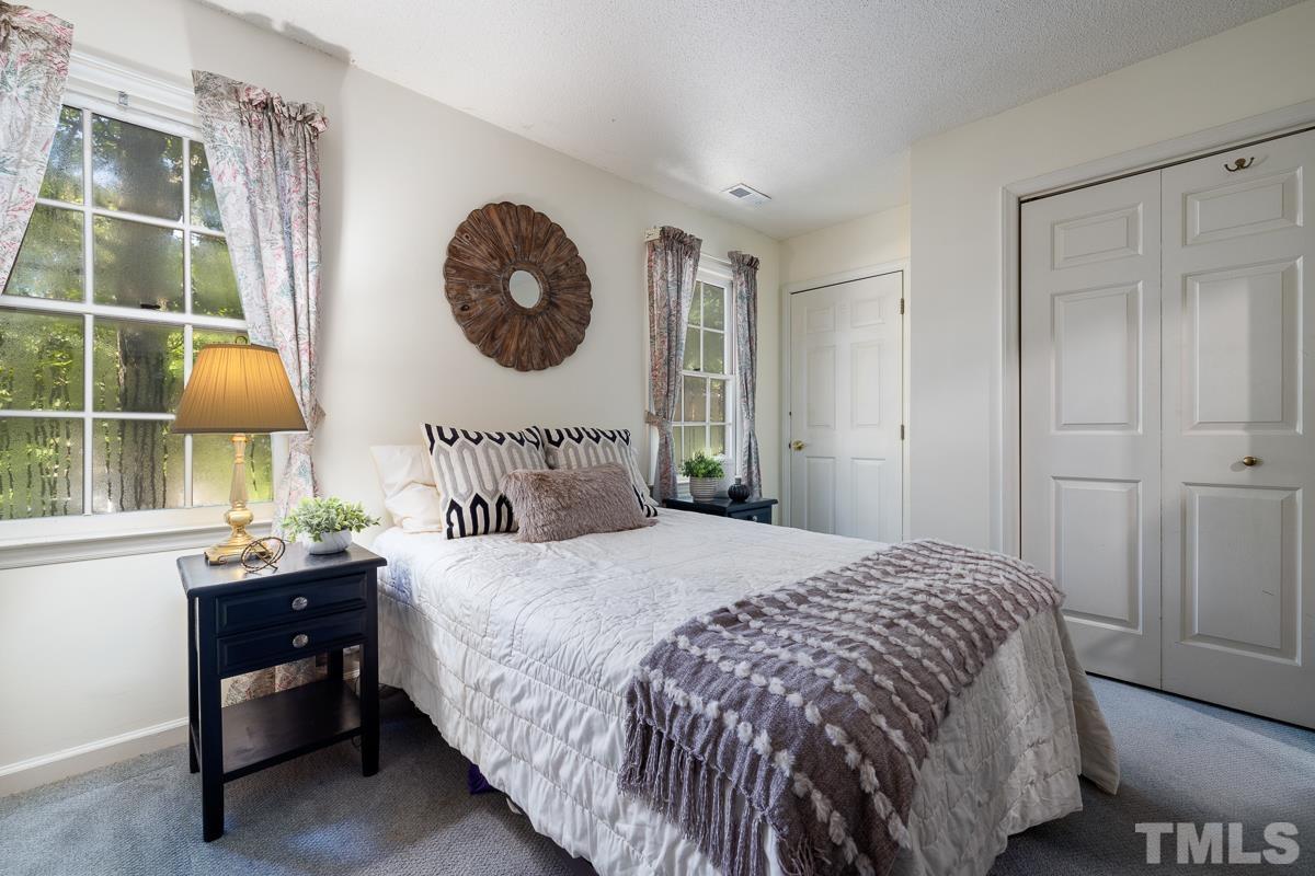 7320 Old Hundred Road Raleigh, NC 27613 - Photo 24 of 39 a bedroom with a bed and a window
