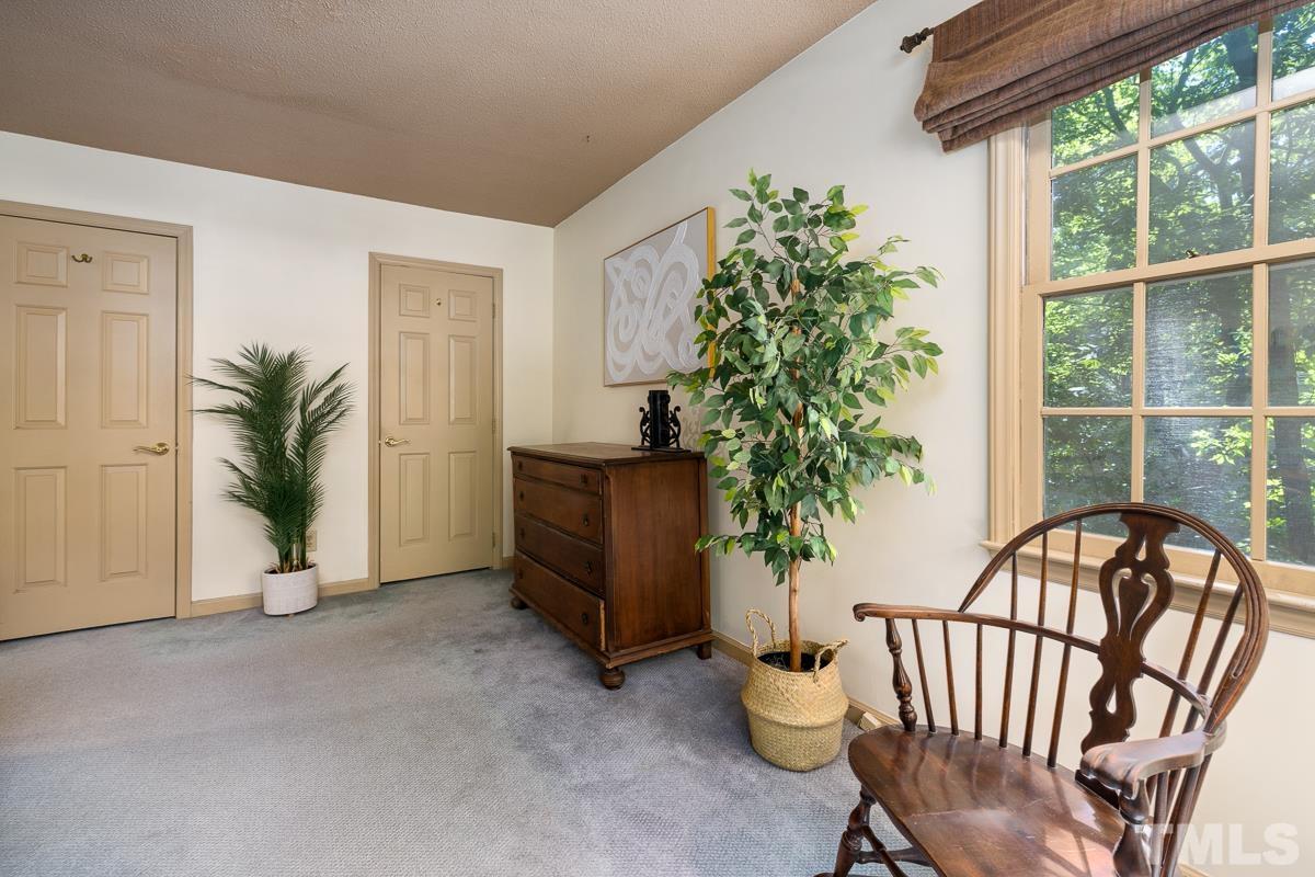 7320 Old Hundred Road Raleigh, NC 27613 - Photo 26 of 39 a view of a porch with furniture and floor to ceiling window
