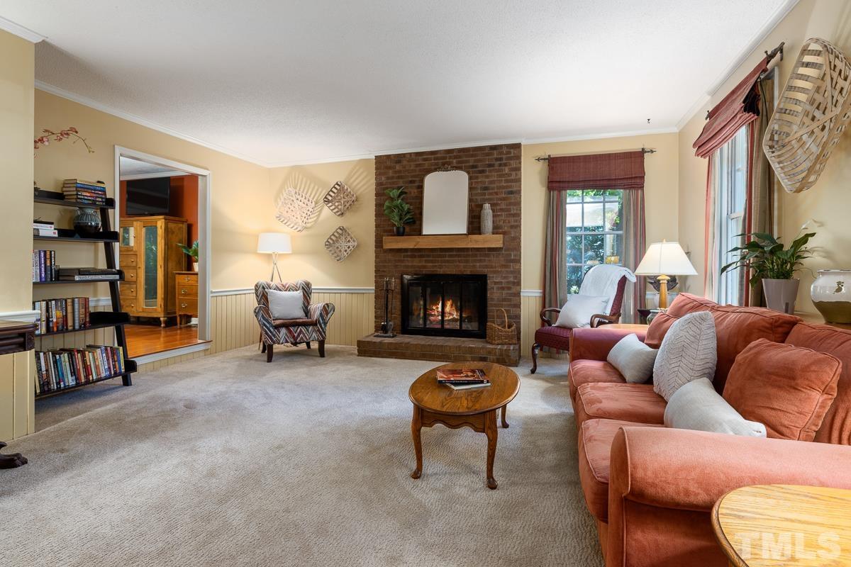 7320 Old Hundred Road Raleigh, NC 27613 - Photo 7 of 39 a living room with furniture and a fireplace