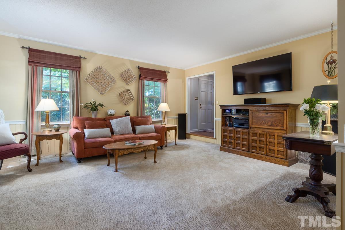 7320 Old Hundred Road Raleigh, NC 27613 - Photo 8 of 39 a living room with furniture and a flat screen tv