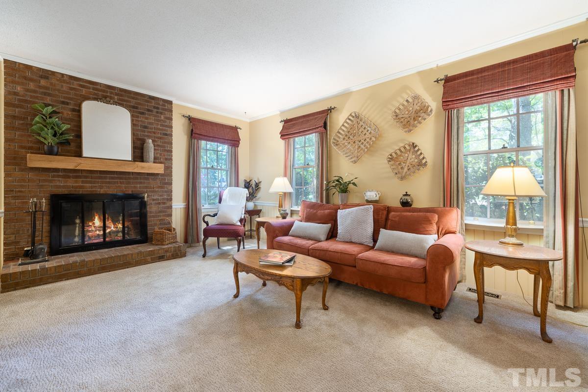 7320 Old Hundred Road Raleigh, NC 27613 - Photo 9 of 39 a living room with furniture and a fireplace