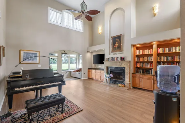 a living room with furniture and fireplace
