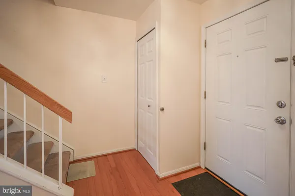 a view of an entryway with wooden floor