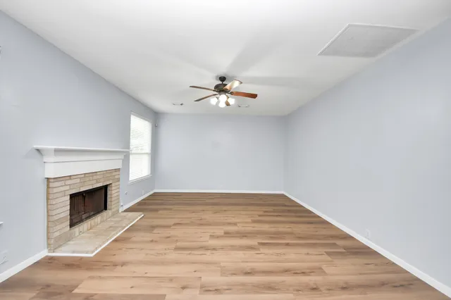 a kitchen with a sink a stove top oven and cabinets