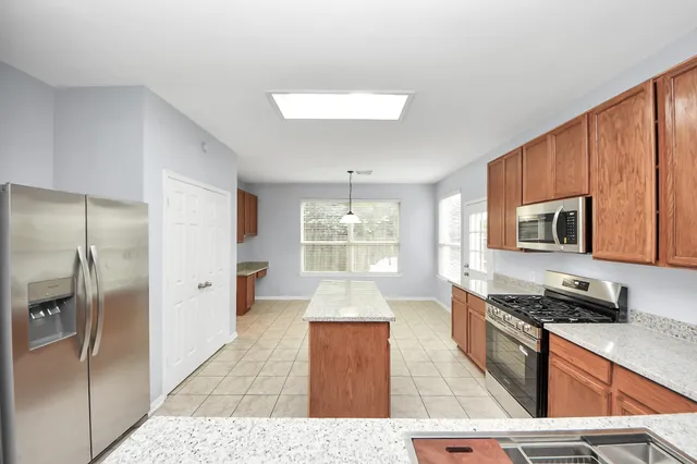 a room with window and cabinet