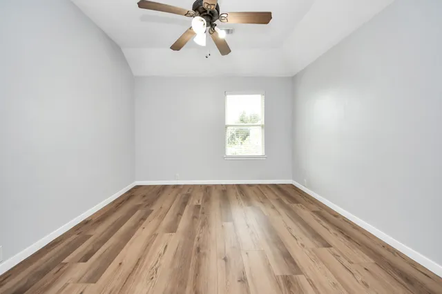 a bathroom with a double vanity sink a toilet and a mirror