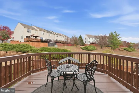 a view of a balcony with furniture