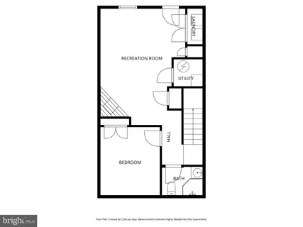 a picture of a bench in front of a wall