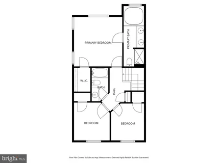 a picture of a bench in front of a wall