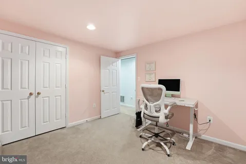 a view of a workspace with furniture