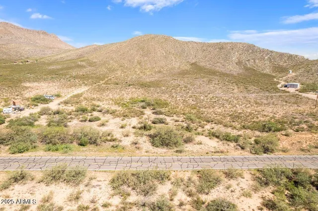 a view of a mountain view with mountains in the background