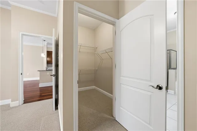 a bathroom with a granite countertop double vanity sink a mirror and a bathtub