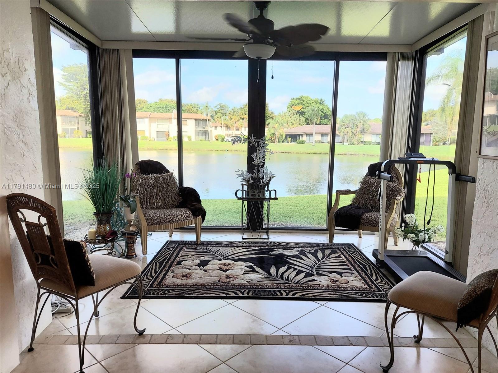 21338 Juego Circle, Unit 11C Boca Raton, FL 33433 - Photo 3 of 17 a living room with furniture and a large window