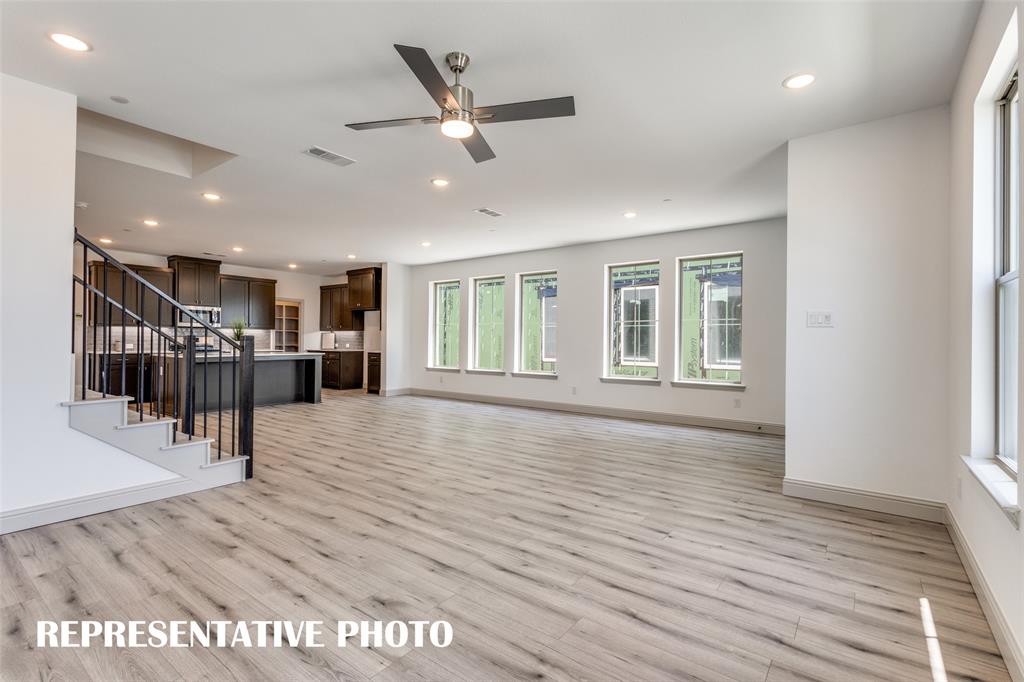 2844 Chisos Red Road McKinney, TX 75071 - Photo 3 of 13 Featuring walls of windows throughout the main floor, this beautiful home is filled with natural light. REPRESENTATIVE PHOTO.