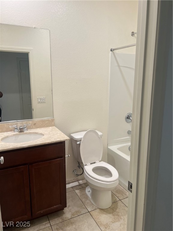 2815 Donatello Manor Place Henderson, NV 89044 - Photo 3 of 14 Full bath featuring tub / shower combination, vanity, light tile patterned flooring, and a textured wall