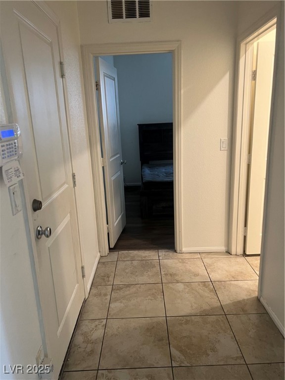 2815 Donatello Manor Place Henderson, NV 89044 - Photo 4 of 14 Corridor featuring baseboards and light tile patterned flooring