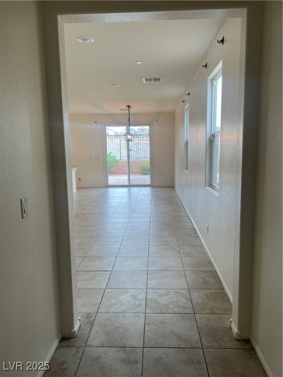 2815 Donatello Manor Place Henderson, NV 89044 - Photo 5 of 14 Hall featuring a textured wall and light tile patterned floors
