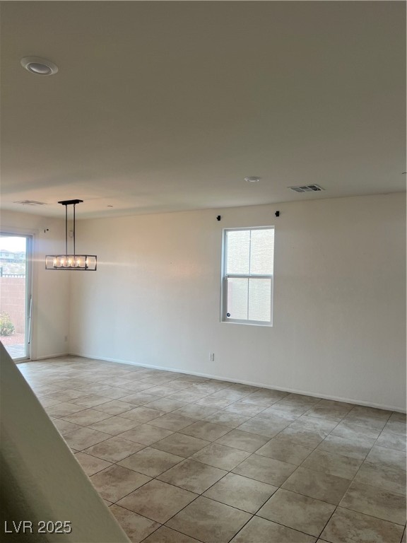 2815 Donatello Manor Place Henderson, NV 89044 - Photo 6 of 14 Unfurnished room with baseboards and light tile patterned floors