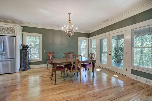 a kitchen with stainless steel appliances granite countertop a stove and cabinets