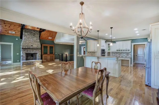 a kitchen with a stove a sink and a refrigerator