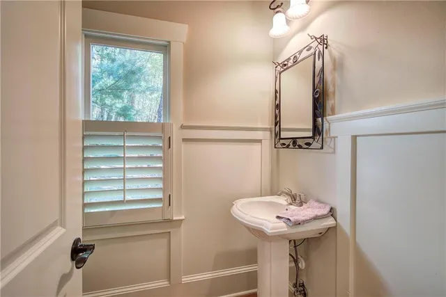 a view of a patio with a table and chairs under an umbrella