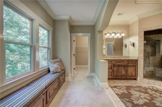 a view of a livingroom with furniture and a fireplace