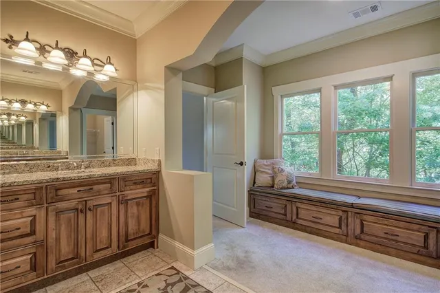 a bedroom with two beds and window