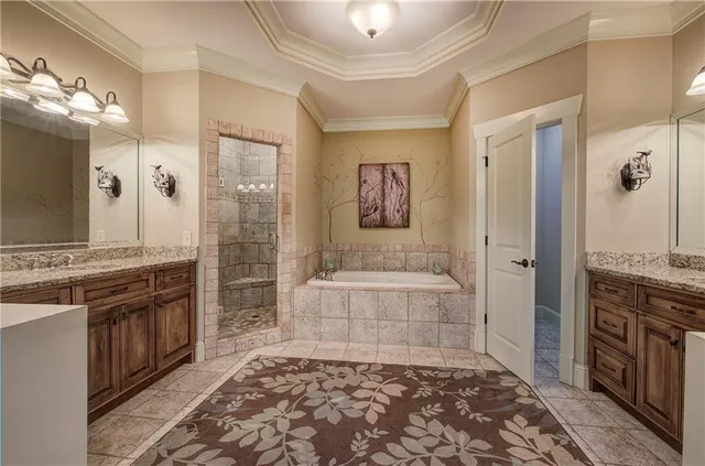 a bathroom with a shower and a bath tub