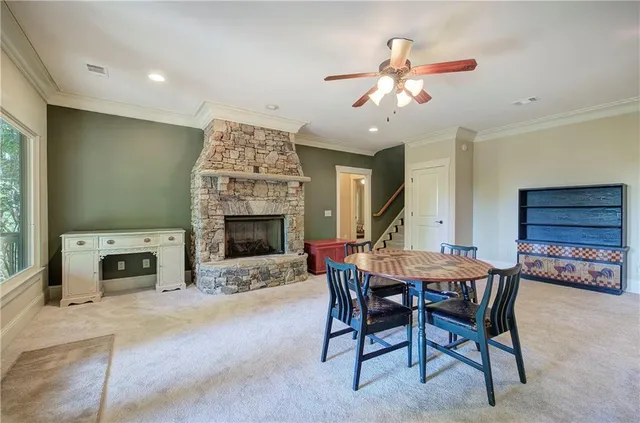 a bathroom with a granite countertop sink a toilet and shower