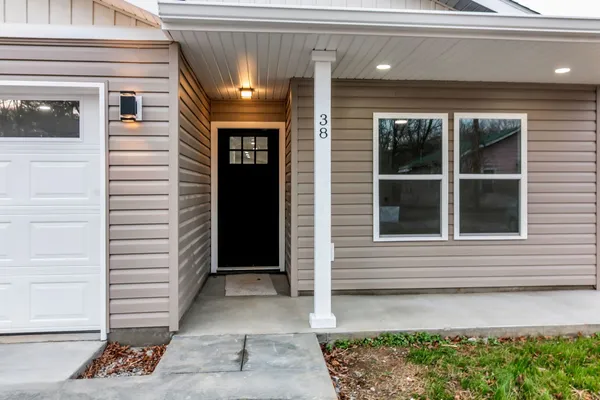 a view of a house with a door and a window