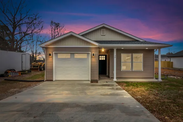 a front view of a house with yard