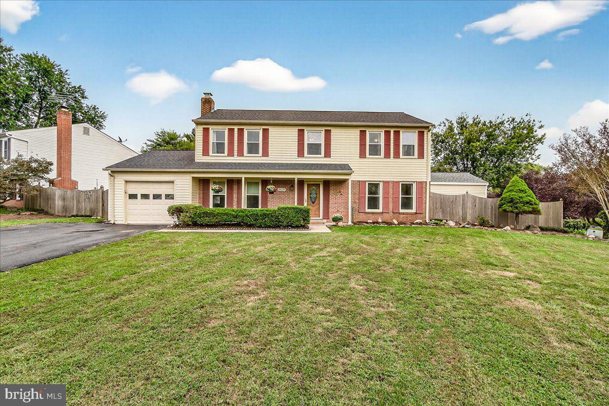 19624 Westerly Avenue Poolesville, MD 20837 - Photo 1 of 44 a front view of a house with a garden