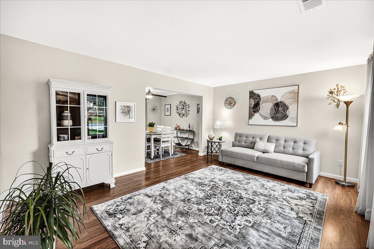 19624 Westerly Avenue Poolesville, MD 20837 - Photo 15 of 44 a living room with furniture and a rug
