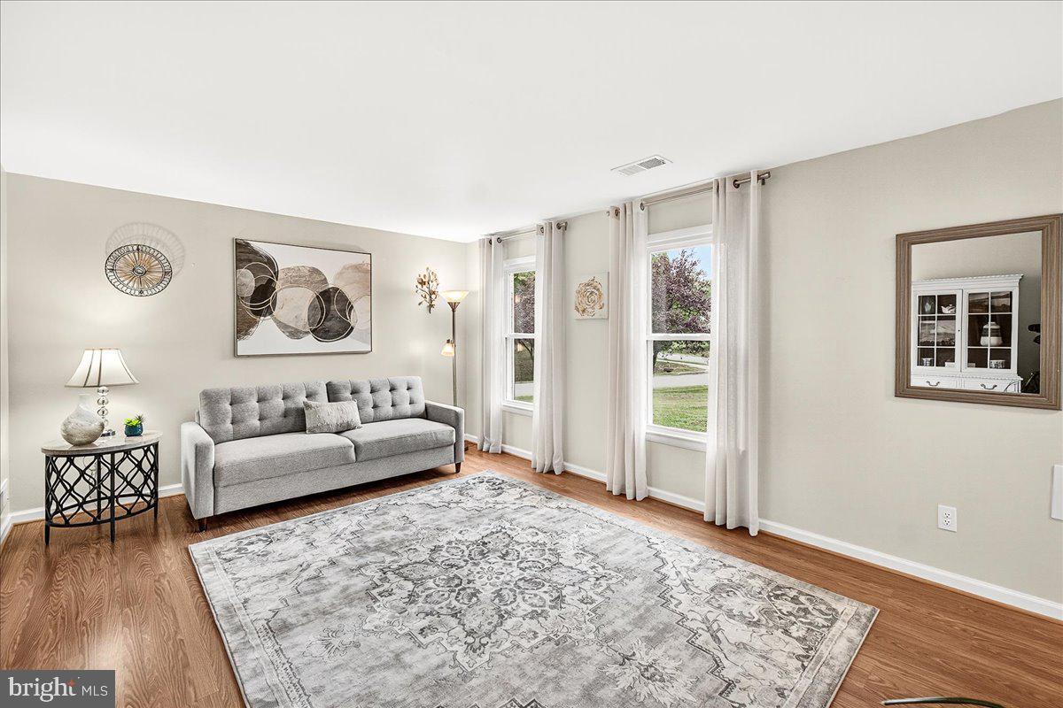 19624 Westerly Avenue Poolesville, MD 20837 - Photo 16 of 44 a living room with furniture and a rug