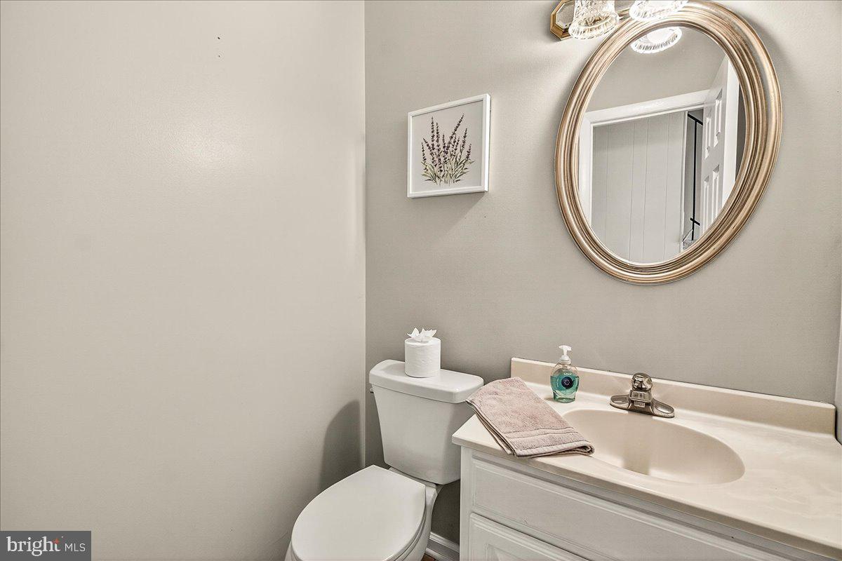 19624 Westerly Avenue Poolesville, MD 20837 - Photo 22 of 44 a bathroom with a toilet and a sink
